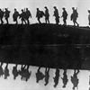 black and white image of soldiers marching