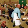 Detail of a festive meal being served from Bruegel the Elder's "The Peasant Wedding."