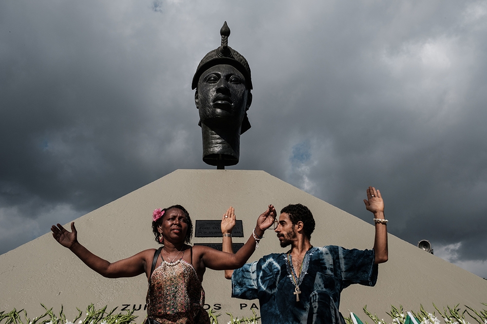 Participants in Brazil’s Black Awareness Day, celebrated annually on the anniversary of Zumbi’s assassination. They are in front of a statue honoring Zumbi.