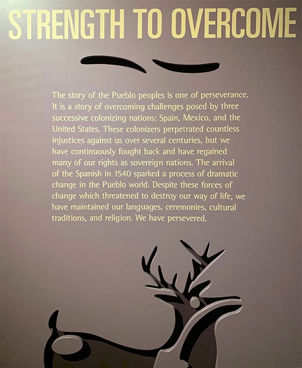Indian Pueblo Cultural Center Museum placard claims the narrative of Pueblo history and resilience