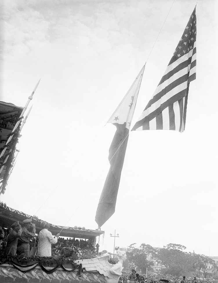 the Philippines flag is raised as the US flag is lowered in Manilla.