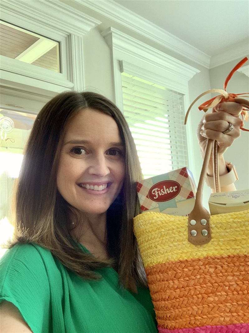 Woman posing with prize basket.